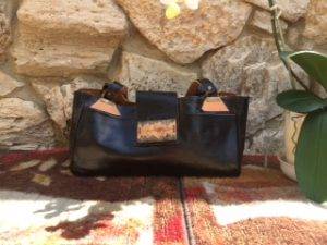 Classy two toned black and tan leather bag hand made by Priddy Stitches.